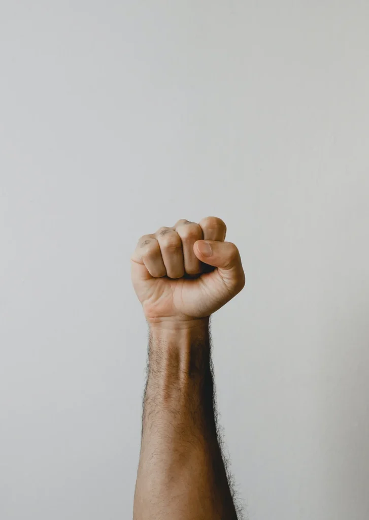 An arm with a closed fist.